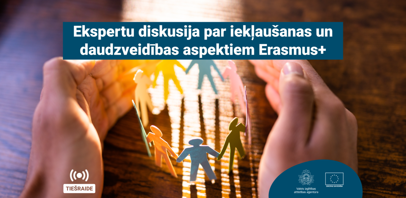 Uz koka galda cilvēka rokas iekļauj mazas, krāsainas cilvēku ikonas